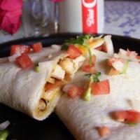 Chicken Quesadilla · Warm flour tortilla, blend of melted cheddar cheeses. Pan seared chicken. Served with pico d...
