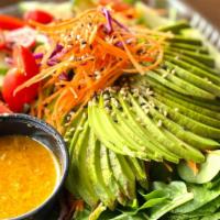 Avocado Salad · Vegetarian. Sliced avocado over mixed greens, carrot, cucumber, tomatoes, sesame seed with g...