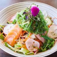 Seafood Salad · Variety of fish over mixed greens, carrot, cucumber, tomatoes, sesame seed with ginger dress...