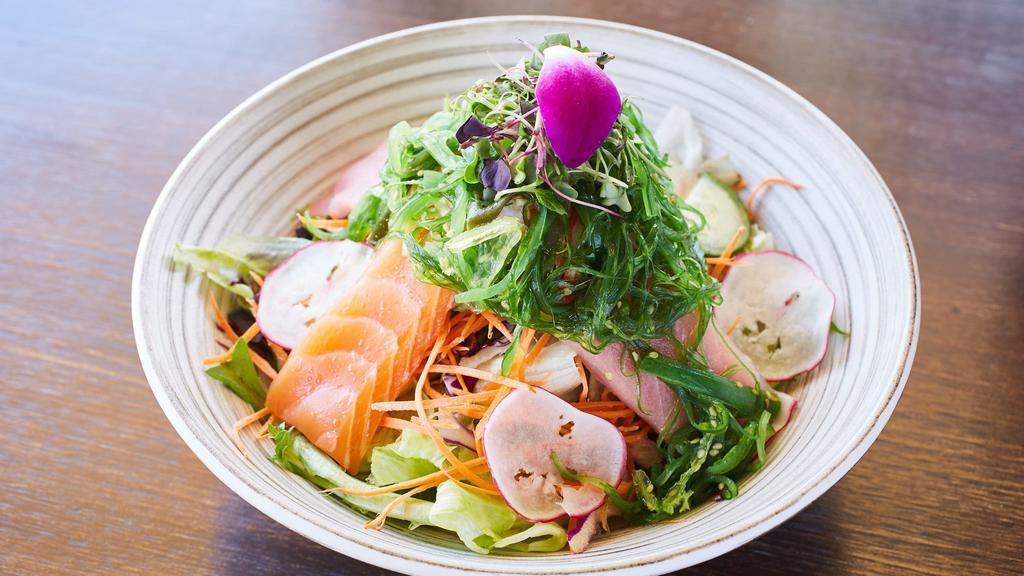 Seafood Salad · Variety of fish over mixed greens, carrot, cucumber, tomatoes, sesame seed with ginger dressing.