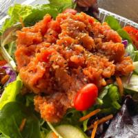 Spicy Tuna Salad · Spicy. Spicy tuna over mixed greens, carrot, cucumber, tomatoes, sesame seed with ginger dre...