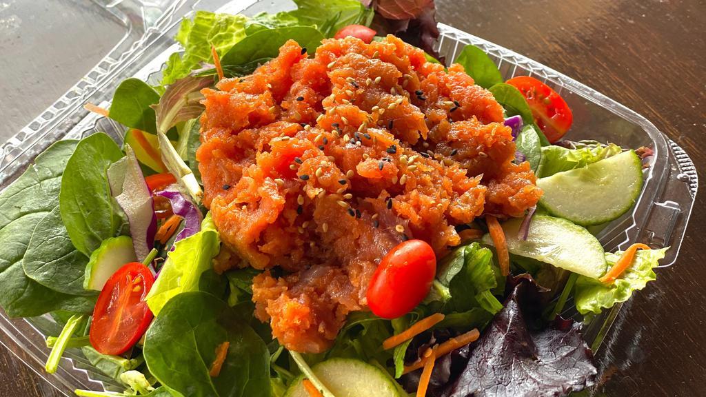 Spicy Tuna Salad · Spicy. Spicy tuna over mixed greens, carrot, cucumber, tomatoes, sesame seed with ginger dressing.