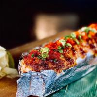 Lion King Roll · Imitation crab, avocado topped baked salmon, cheese, masago, and unagi sauce.