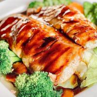 SALMON TERIYAKI · Grilled salmon over rice with steam mix vegetable topped teriyaki sauce
