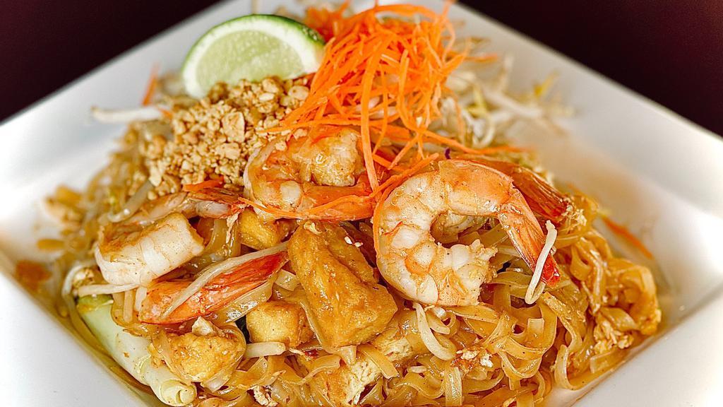 Pad Thai · Stir fried thin rice noodle with egg, tofu, chive, bean sprout topped ground peanut.