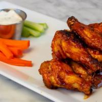 Woodfired Chicken Wings · wings, peppercorn ranch, choice of chipotle barbecue glaze or buffalo sauce