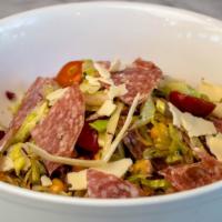 Half Italian Chopped Salad · iceberg, radicchio, red onion, salami, aged provolone, chickpeas, pepperoncini, tomatoes, sh...