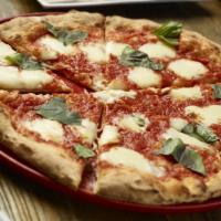 Margherita Pizza · crushed tomato, mozzarella, parmesan, torn basil