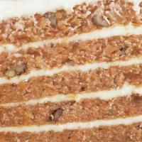 Big Carrot Cake · Six layers of moist carrot cake sandwiched with our smooth cream cheese icing all studded wi...