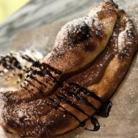 Nutella Cloud · The best way to end a meal is our nutella cloud. Warm salty pizza dough topped with creamy N...