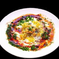 Mosbaha · Hummus mixed with whole chickpeas, garlic lemon pepper, and topped with olive oil served war...