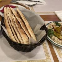 Baba Ghannoush · Roasted eggplant blended with tahini, parsley, lemon juice and topped off with olive oil.
in...