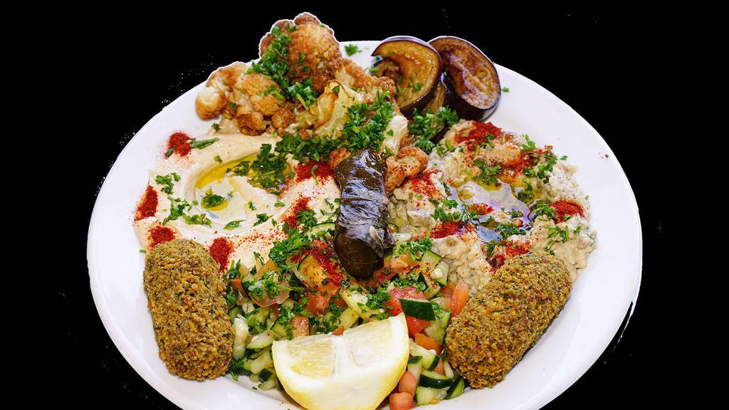 Vegetarian Combo Plater · Served with rice and salad. Hummus, Baba Ghanoush, Arabic salad, Fried eggplant and cauliflower, falafel, and dolma