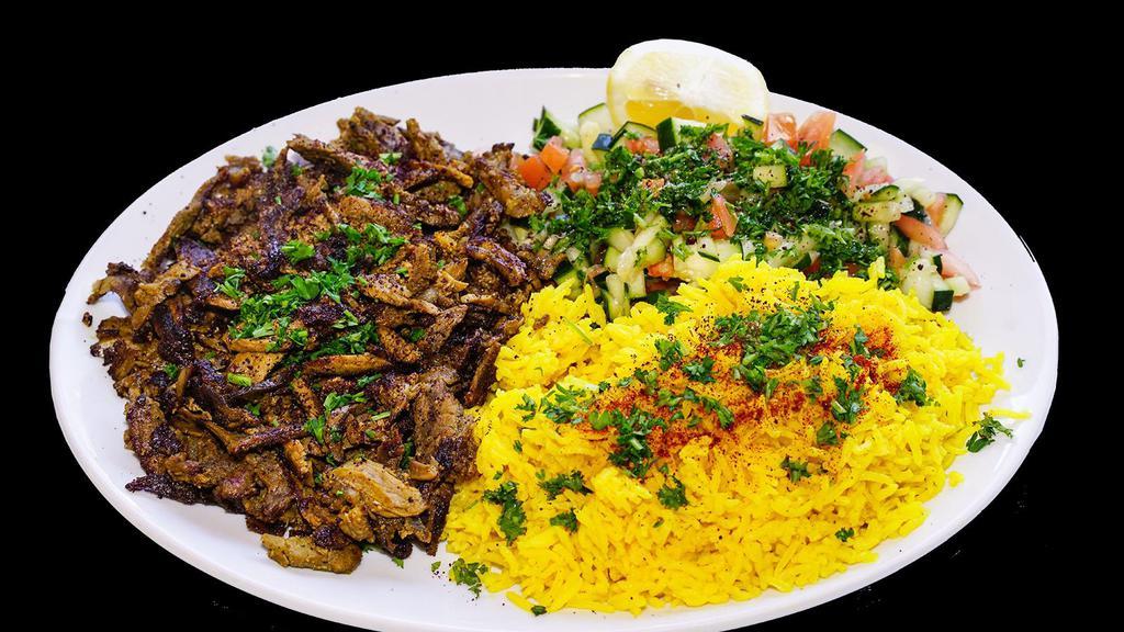 Beef & Lamb Shawarma Plate · Served with rice and salad.