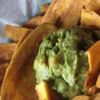Platanutres con Dip de Aguacate · Avocado dip blended with cheese and onions served with thin fried plantain chips.