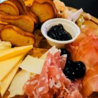 Charcuterie Board · Prosciutto di parma, salami tuscano, dutch blue cheese, Gouda cheese, pickled vegetables, ol...