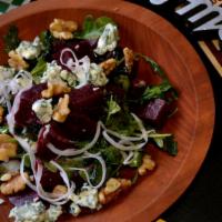 House · Kale, arugula, Dutch blue cheese, and walnuts with a creamy honey or balsamic vinaigrette dr...