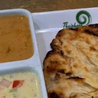 12. Roti & Two Curry Sauce · Indian-style bread served with green curry and peanut sauce.