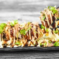 Takoyaki · Octopus, bonito flakes, mayonnaise, okonomi sauce.