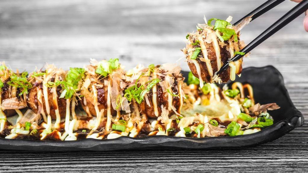 Takoyaki · Octopus, bonito flakes, mayonnaise, okonomi sauce.