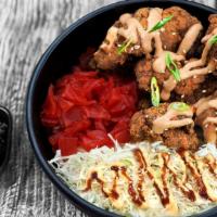 Chicken Karaage Rice Bowl · Rice, obu sweet and shinobi sauce, chicken karaage, fukujinzuke pickles, shredded cabbage, g...
