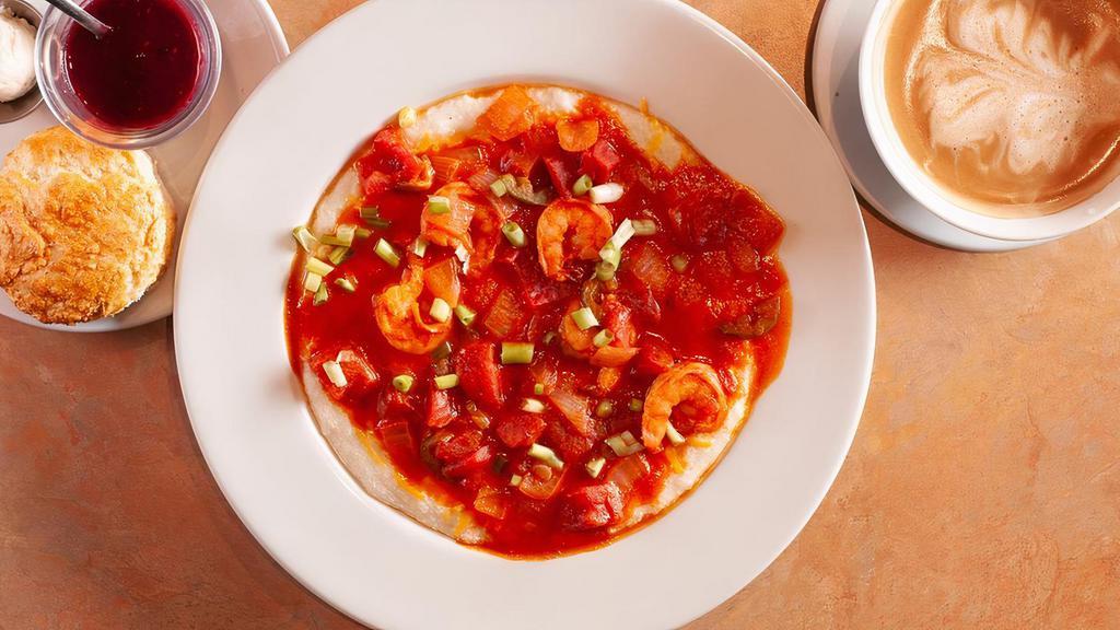 Shrimp and Grits · Sautéed  Shrimps, green onions, jalapeños over cheesy grits and topped with tomato sauce.
