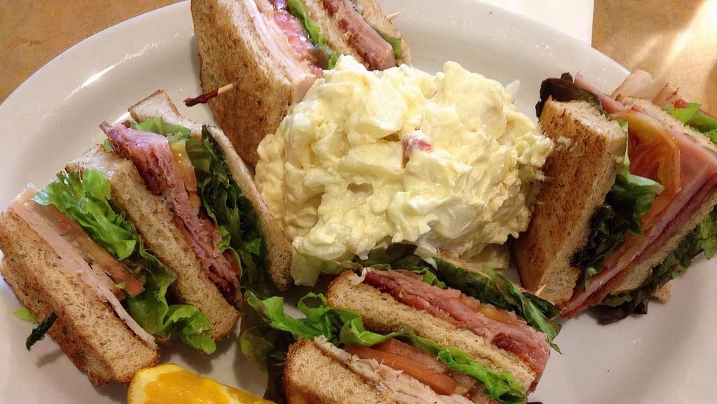 Club Sandwich · Ham, bacon, turkey, lettuce, tomato, and avocado.