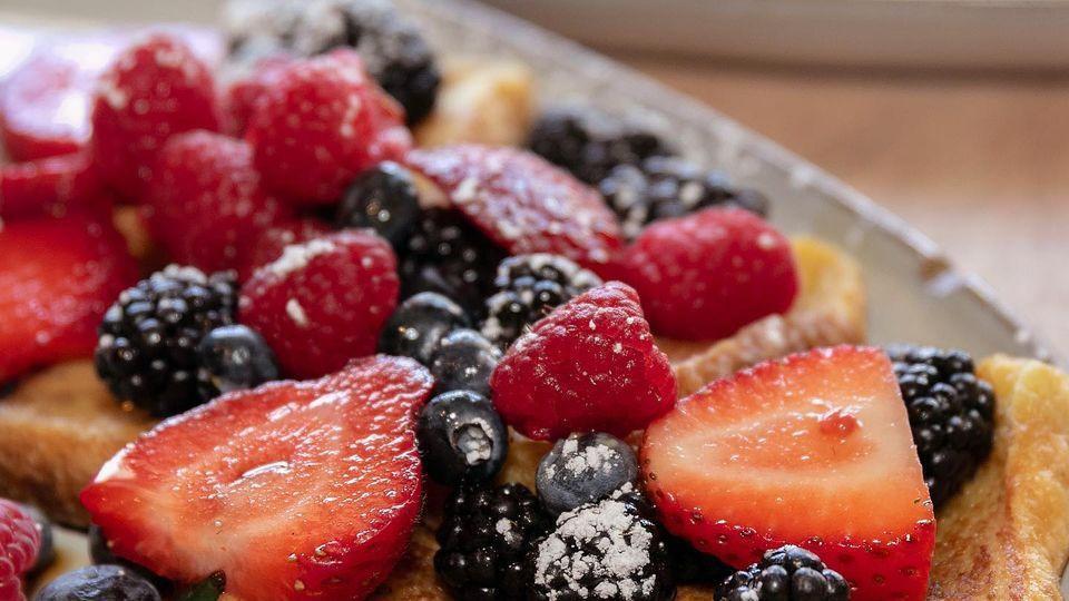 Capullo's Pancakes · 3 pancakes served with berries, syrup & cajeta.