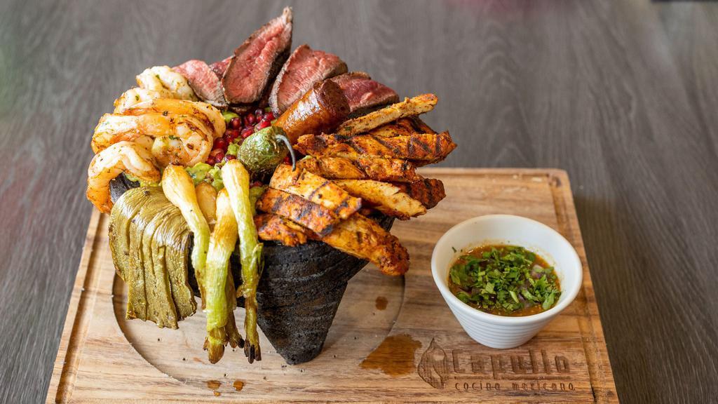 Capullo's Molcajete · Guacamole, grilled ribeye steak, grilled chicken,
grilled prawns & grilled cactus chorizo, spring
onions & grilled jalapeños served with
quesadillas.