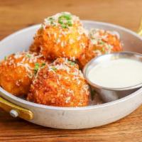 Mac & Cheese Balls · Beer cheese sauce, Fresno chiles, chives, and parmesan.