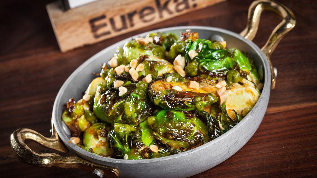 Crispy Glazed Brussels Sprouts · Orange chile glaze, chimichurri, and almonds.