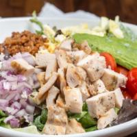 Cobb Salad · Chicken, bleu cheese, egg, avocado, bacon, tomatoes, red onions, and ranch.