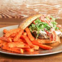 Fresno Fig Burger · Fig marmalade, melted goat cheese, bacon, tomatoes, red onions, arugula, and spicy porter mu...