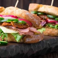 Hot Turkey & Roast Beef Sandwich · Juicy slices of turkey and roast beef, jalapeños, onions, pickled peppers, tomato, lettuce, ...