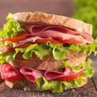 Cold Salami Sandwich  · Flavorful salami, jalapeños, pickled peppers, tomato, onions, lettuce, mayo & mustard.