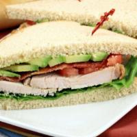 Hot Turkey Sandwich · Warm slices of turkey, jalapeños, pickled peppers, tomato, onions, lettuce, mayo & mustard.