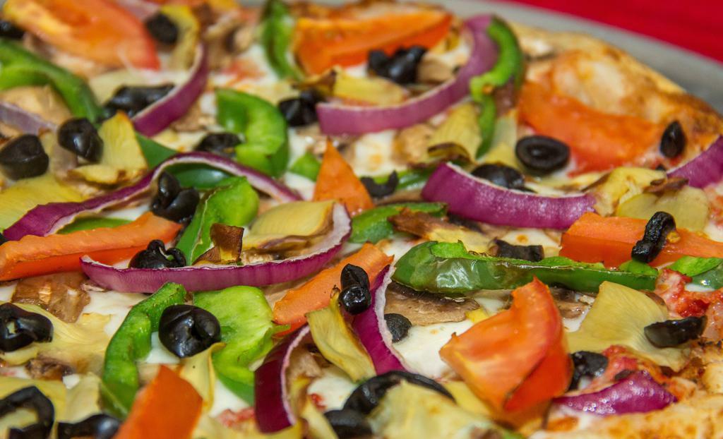 11. Veggie Deluxe Pizza · Homemade tomato sauce, Shredded Whole Milk Mozzarella Cheese, Fresh Mushrooms, Black Olives, Artichoke Hearts, Fresh Tomatoes, Onions & Green Peppers .