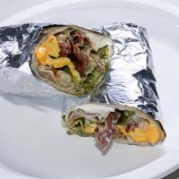 Breakfast Burrito · Turkey Bacon, Eggs, Shredded Cheese, Tater Tots, Lettuce, Tomatoes, Salsa