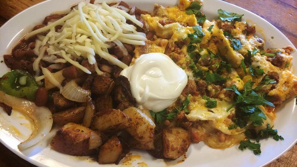 Chorizo scrambled  · Chorizo with scrambled eggs, jack cheese, served with beans, potato, sour cream and tortillas