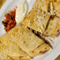 Quesadilla · Corn or flour tortilla filled with cheese and served with salsa fresca.