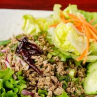 18. Larb · Hot. Choice of ground chicken, beef or pork mixed with red onions, mint cilantro, lime juice...