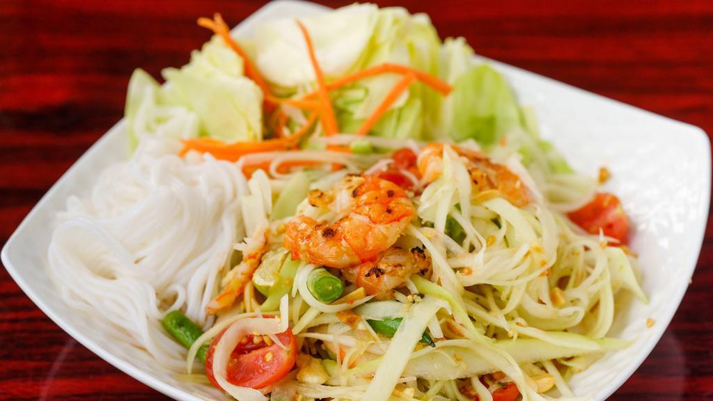 16. Som Tum Thai (Papaya Salad with Dried Shrimp) · Hot. Shredded green papaya salad with dried shrimp, tomatoes, green beans, carrots, and peanuts tossed in a chili-lime dressing.