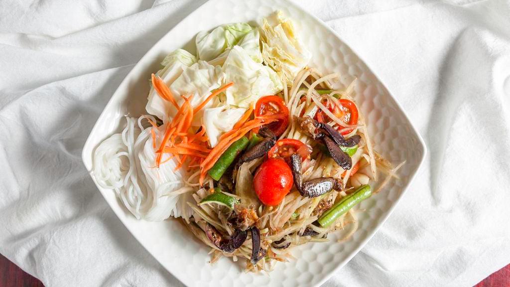 17. Som Tum Poo (Papaya Salad with Salted Crabs) · Hot. Shredded green papaya salad with salted crabs, tomatoes, green beans, and carrots tossed in a chili-lime dressing.
