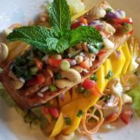 S2. Salmon Mango Salad · Grill Salmon with fresh mango served with lettuce salad and chili lime dressing sauce. Toppe...