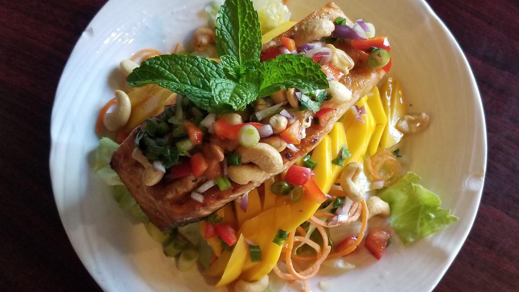 S2. Salmon Mango Salad · Grill Salmon with fresh mango served with lettuce salad and chili lime dressing sauce. Topped with cashew nuts