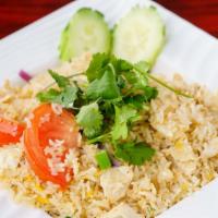 66. Kao Pad · Thai style fried rice with tomatoes, eggs and onions with choice of beef, chicken or pork.