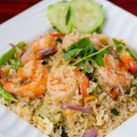 71. Kao Pad Nam Prig · Hot. Thai style fried rice with shrimp paste, shrimp, eggs, Chinese broccoli, onions, and ch...
