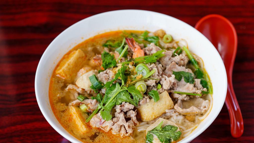 56. Tom Yum Noodle Soup · Hot. Hot and spicy noodle soup served with ground pork, sliced pork, pork balls, shrimp, fish cake, and ground peanuts.