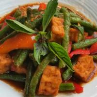 97. Tofu Prig King · Hot. Sautéed crispy tofu with green beans, chili paste and bell peppers.