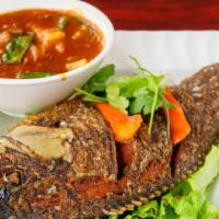 88. Pla Rad Prig (Whole Fish) · Hot. Deep fried whole tilapia topped with red bell pepper, onions, chili paste and crispy ba...